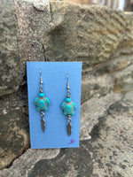 Turtle and feather charm earrings made by Laura Bushyhead